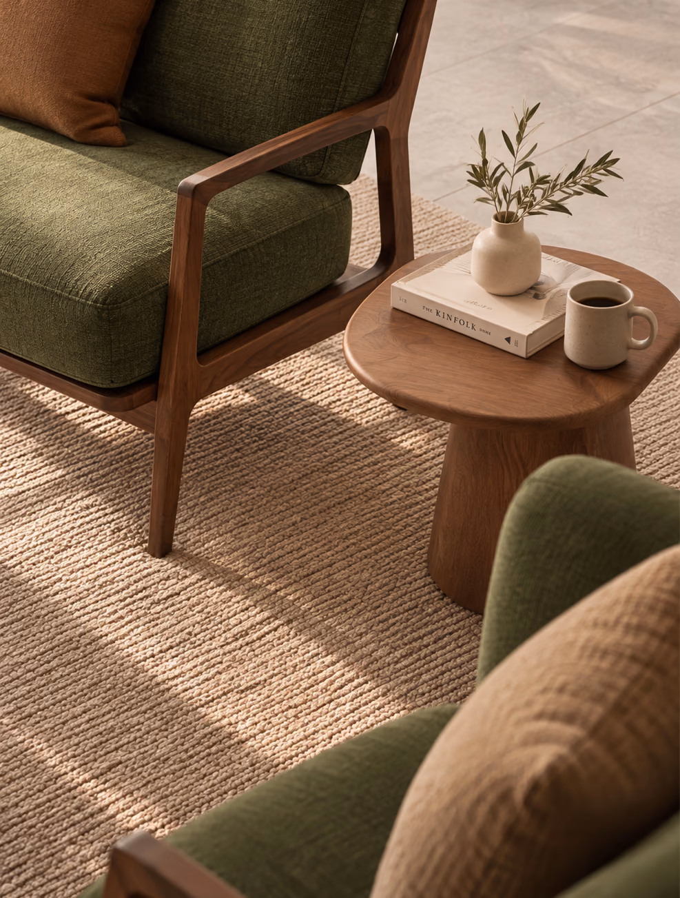 Arlo Lounge Chair cushion next to a wooden side table with a coffee mug